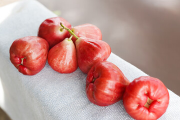 A bunch of Rose apples or chomphu fruit on a table