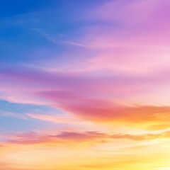 Fototapeta premium Vibrant Sunset Sky Displaying Gradient Hues Of Yellow Orange Pink And Blue With Textured Clouds Creates Dramatic Peaceful Scene