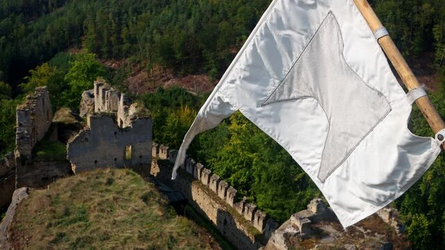View from the tower of the medieval castle with a flying replica of the historical banner, Czechia