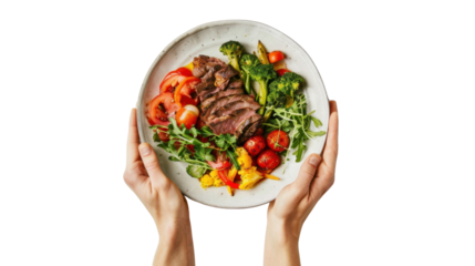 Chef holding plate with healthy grilled steak, vegetables and transparent background