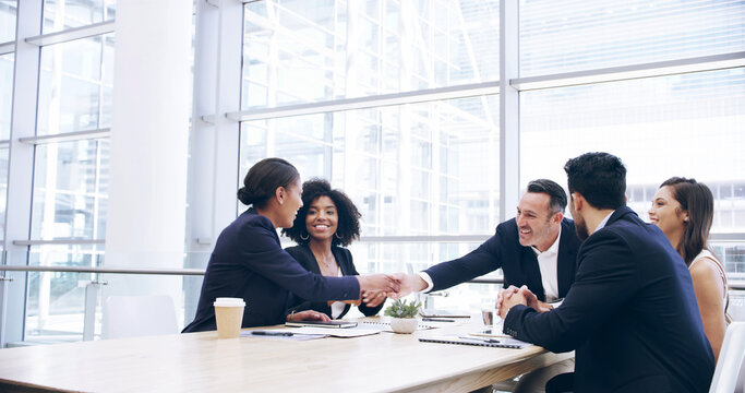 Group, handshake and business people in office, success or partnership for company merger. Employees, coworking or team shaking hands, profit growth or celebration with collaboration, deal or welcome