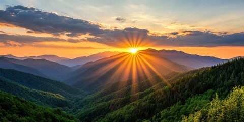 A breathtaking sunrise over rolling mountains, casting golden rays through the clouds, creating a serene and peaceful landscape.
