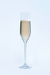 Elegant flute filled with celebratory sparkling drink, ready for toasting in a festive atmosphere.