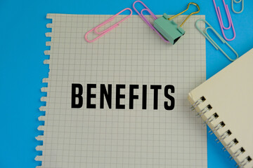 plain paper with the word benefits. the concept of income or profit