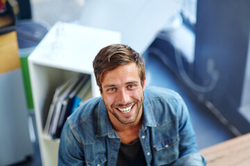 Man, teacher and happy with portrait in library for lesson research, academic knowledge and learning information. Above, educator and smile at school for language education and assignment resources