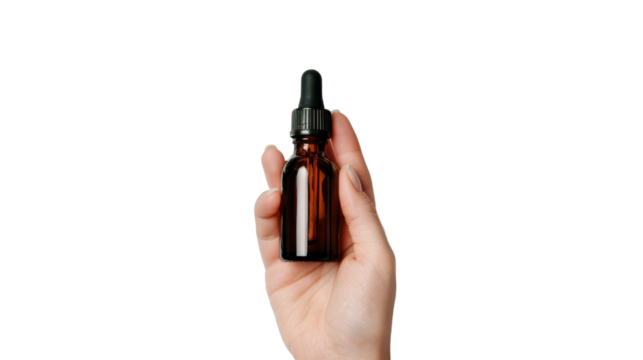 Woman hand holding amber glass dropper bottle with black cap on transparent background