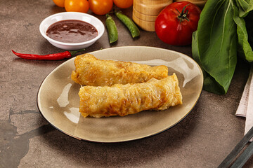 Vietnamese stuffed spring roll served sauce