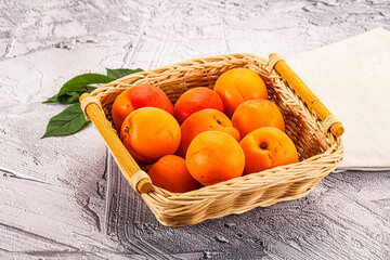 Raw ripe sweet apricots heap