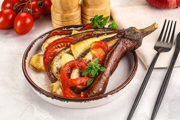 Baked tomato with mozzarella and tomato