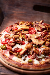 Gyros Pizza with jalapeno pepper, cherry tomatoes and mozzarella cheese. Soft focus. Close up.