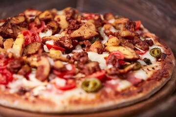 Gyros Pizza with jalapeno pepper, cherry tomatoes and mozzarella cheese. Soft focus. Close up.