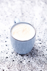 Cappuccino on bright background. Soft focus. Copy space.