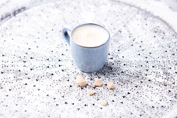 Cappuccino on bright background. Soft focus. Copy space.