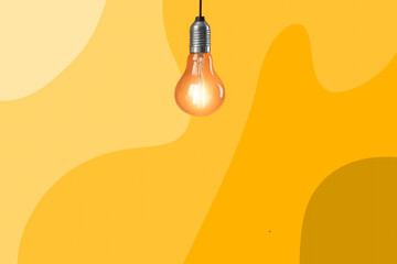 Orange light bulb on orange background