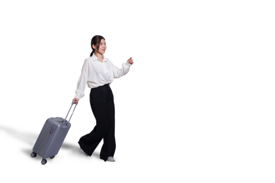 Cheerful young Asian woman holding suitcase with walking to the front, isolated on white background. Concept tourist holiday trip, cut out