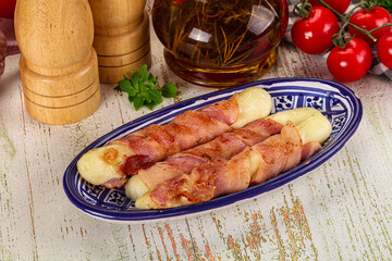 Hot mozzarella sticks with bacon