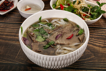 Vietnamese Pho Bo soup with beef and noodles