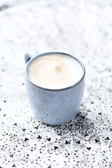Cappuccino on bright background. Soft focus. Copy space.