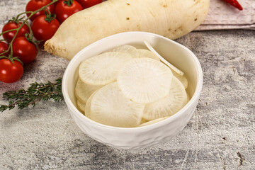 Sliced white daikon radish in the bowl