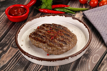 Grilled beef burger cutlet with sauce