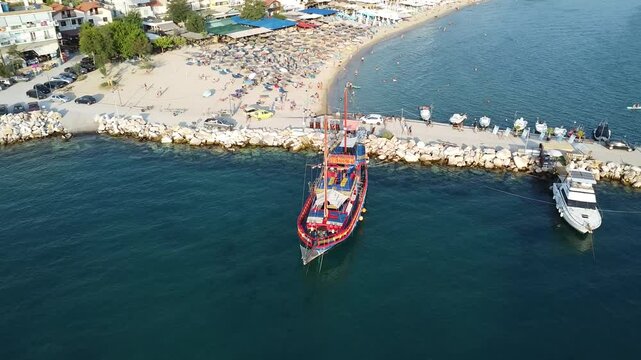 Aerial video over boats and coastline on Potos Island Greece