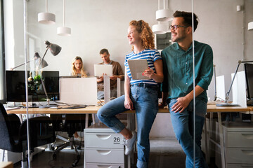 Business solutions, technology and strategy concept. Colleagues working and brainstorming in office