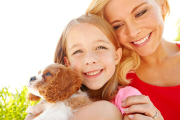 Outdoor, mom and child with dog after adoption, puppy care and bonding together with happiness....