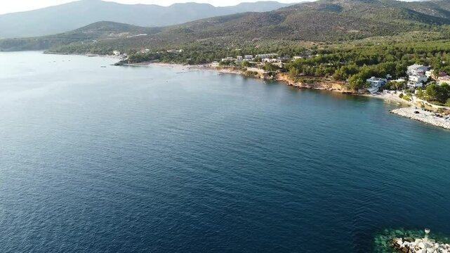 Aerial video over boats and coastline on Potos Island Greece