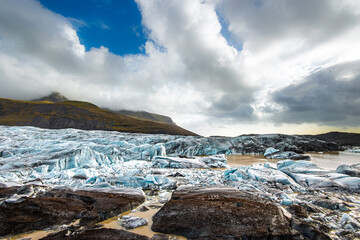 Glacial landscape of Jokulsarlon showcasing ice formations and dramatic clouds