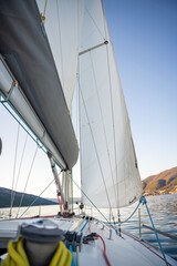Naklejka premium Yacht sailing in Adriatic sea. Close-up view of the deck, mast and sails. Yachting concept