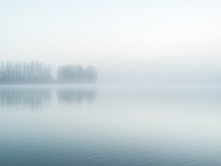 Fototapeta premium Ethereal waterscape, Silhouettes of trees disappearing into the misty horizon