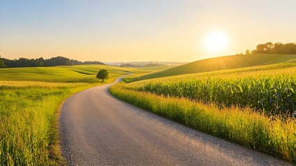Fototapeta premium A winding dirt road runs through lush green fields under a golden sunrise, creating a serene countryside landscape. Concept Winding Dirt Road, Lush Green Fields, Golden Sunrise, Serene Countryside