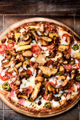 Gyros Pizza with jalapeno pepper, cherry tomatoes and mozzarella cheese. Soft focus. Close up.
