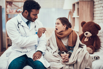 doctor examining little girl