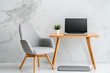 Modern workspace featuring a desk, laptop, chair, and potted plant against a light marble wall.