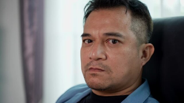 Close up shot, Face of Frustrated Businessman or Boss showed angry expression, staring and gnash with anger at office