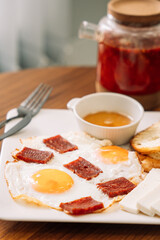 fried eggs with sausage for breakfast.