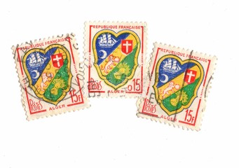 Used postage stamps from France featuring a medieval shield.