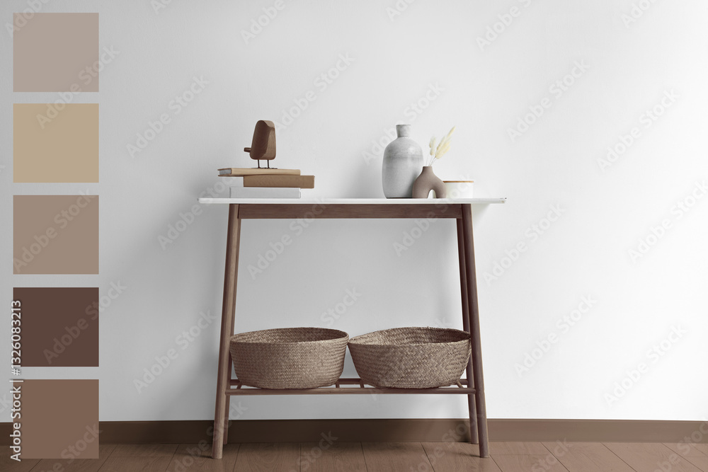 Poster Console table with decorative elements in mocha mousse shade. Interior design with matching color palette