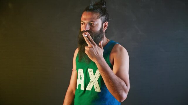 Smoker releases thick fumes displaying attitude