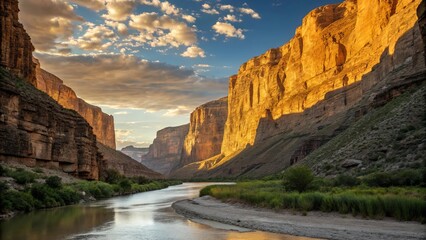 Majestic Canyon Landscape with River and Mountains During Sunset