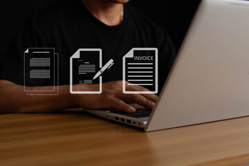 Electronic invoice and online invoice concept. Digital electronic invoice and electronic invoice account. Businessman using laptop to manage invoice document so display icon on virtual screen.