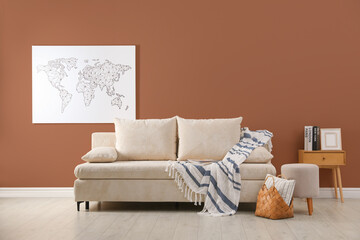 Stylish living room with wall in mocha mousse shade. Interior design with trendy color of 2025 year
