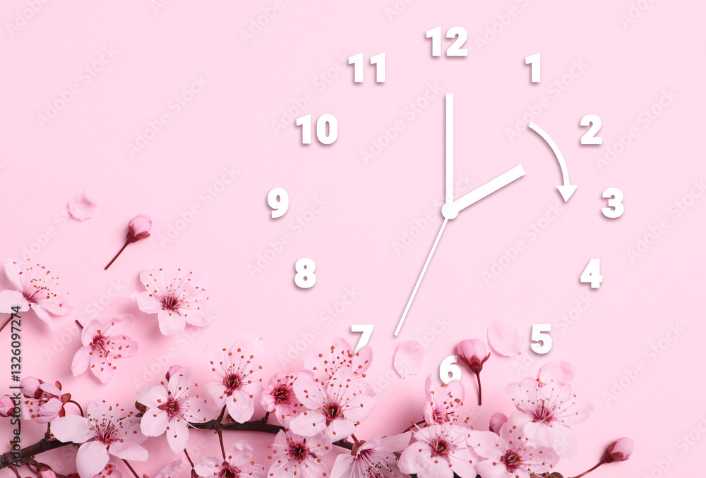 Poster clock and blossoming branch with flowers on pink background, top view. arrow showing time change one
