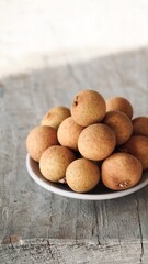 Close-up of fresh lychees on the table.