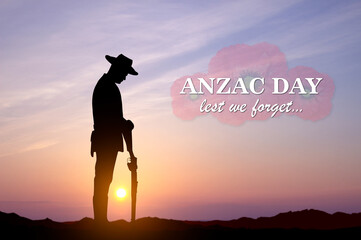 Silhouette of soldier paying tribute against the sunset. Anzac Day concept. Lest We Forget