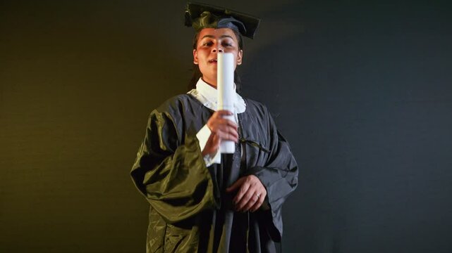 Young scholar into convocation attire celebrates victory