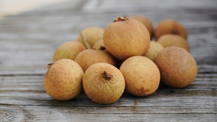 Close-up of fresh lychees on the table.