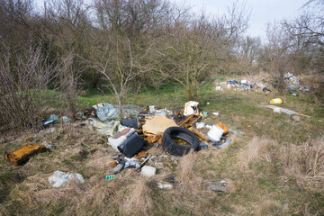 Illegal waste dump in the forest. Ecological disaster. Human stupidity, pollution of our own...