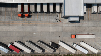 Top view semi truck cargo trailer at logistic park warehouse goods, Distribution warehouse shipping...